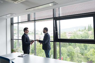 Image showing cloasing the deal in modern office interior