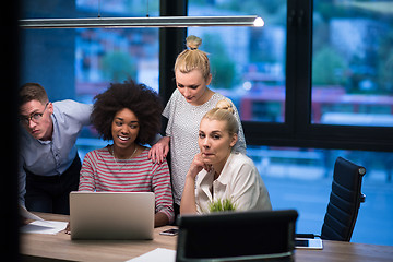 Image showing Multiethnic startup business team in night office