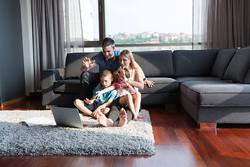 Image showing Family Playing Together with laptop computer