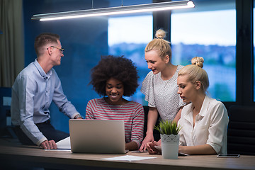 Image showing Multiethnic startup business team in night office