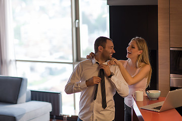 Image showing A young couple is preparing for a job and using a laptop