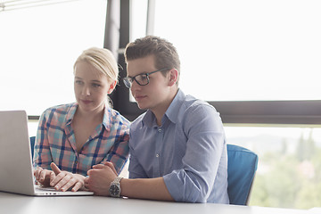 Image showing Two Business People Working With laptop in office