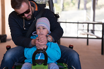 Image showing father and son enjoys driving on alpine coaster