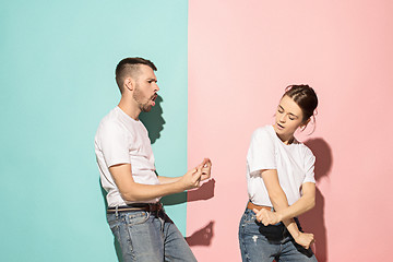 Image showing A couple of young man and woman dancing hip-hop at studio.