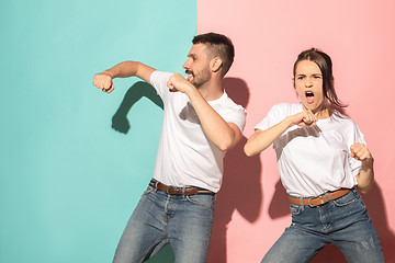 Image showing A couple of young man and woman dancing hip-hop at studio.