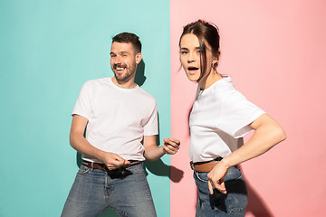 Image showing A couple of young man and woman dancing hip-hop at studio.