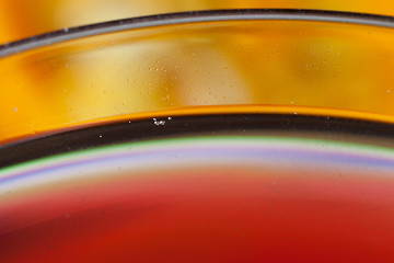 Image showing Detail of a glass with red wine and bubbles