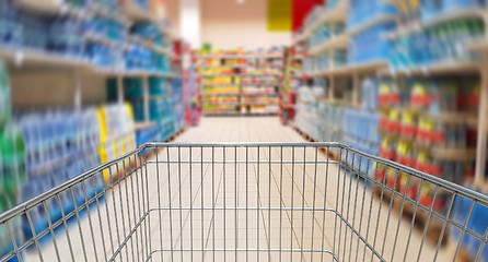 Image showing Speeding mall aisle with shopping cart