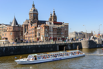 Image showing Sightseeng at Canal Boats near the Central Station of Amsterdam