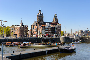 Image showing Sightseeng at Canal Boats near the Central Station of Amsterdam