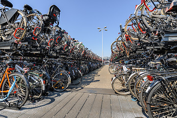 Image showing AMSTERDAM, HOLLAND - AUGUST 01: Amsterdam Central station. Many bicycles parked in front of the Central station on August 01, 2012 in Amsterdam, Holland.