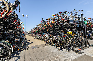 Image showing AMSTERDAM, HOLLAND - AUGUST 01: Amsterdam Central station. Many bicycles parked in front of the Central station on August 01, 2012 in Amsterdam, Holland.