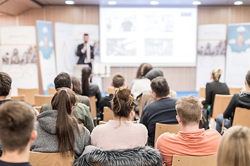 Image showing Man giving presentation in lecture hall at university.