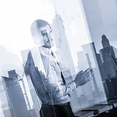 Image showing Business presentation on corporate meeting against new york city window reflections.