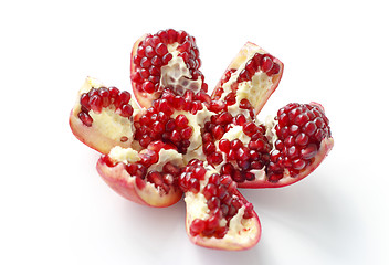 Image showing Tasty cut pomegranate fruit on white background