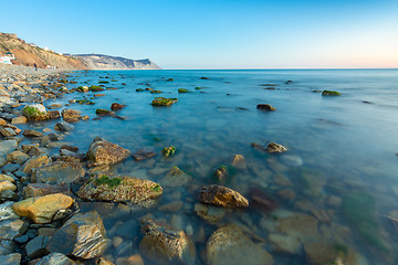 Image showing Stony sea beach of the 40th anniversary of the victory of the high coast of Anapa at sunset, Black Sea, Anapa, Russia