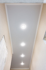 Image showing Stretch ceiling in a long narrow corridor