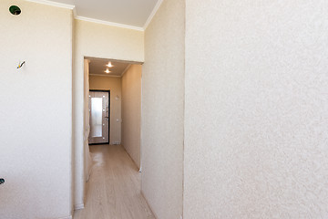 Image showing A long corridor in the apartment, going from the kitchen to the exit