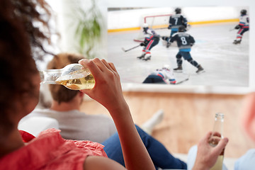 Image showing friends watching ice hockey and drinking beer