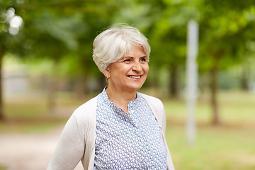 Image showing portrait of happy senior woman at summer park