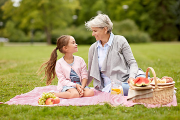 Image showing grandmother and granddaughter at picnic in park