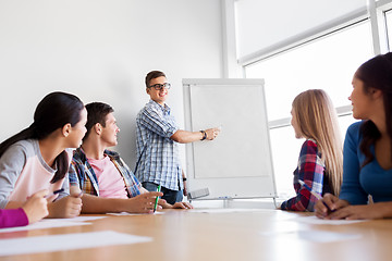 Image showing group of high school students with flip chart