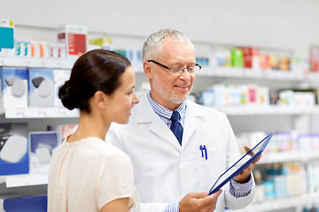 Image showing apothecary and customer with tablet pc at pharmacy