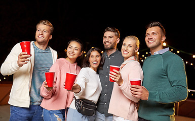 Image showing friends with drinks at rooftop party