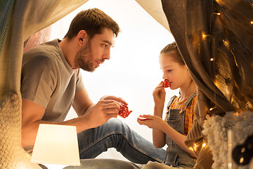 Image showing family playing tea party in kids tent at home