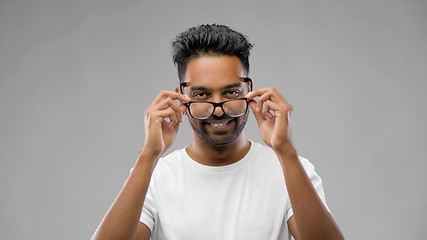 Image showing happy indian man in eyeglasses or student