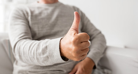 Image showing close up of senior man showing thumbs up