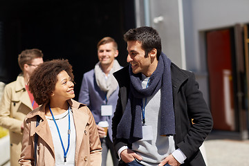 Image showing business team with conference badges in city