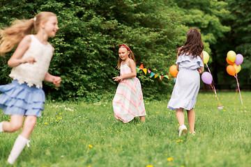 Image showing happy girls playing tag game at birthday party