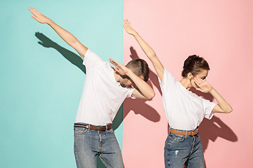 Image showing A couple of young man and woman dancing hip-hop at studio.