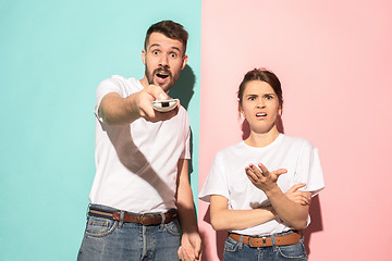 Image showing Closeup portrait of young couple, man, woman. One being excited 