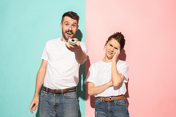 Image showing Closeup portrait of young couple, man, woman. One being excited 