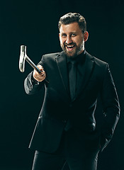 Image showing The barded man in a suit holding cane.