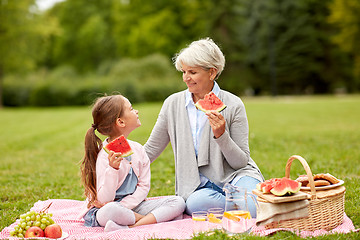 Image showing grandmother and granddaughter at picnic in park