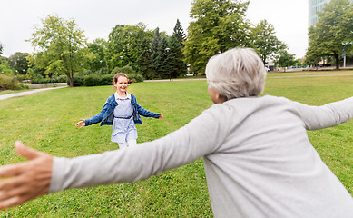 Image showing grandmother and granddaughter playing at park
