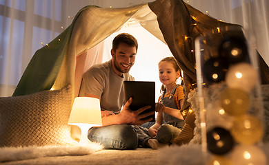 Image showing family with tablet pc in kids tent at home