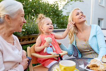 Image showing mother, daughter and grandmother at cafe