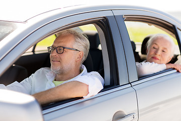 Image showing happy senior couple driving in car