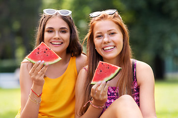 Image showing teenage girls eating watermelon at picnic in park