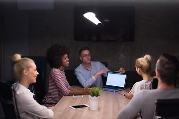 Image showing Multiethnic startup business team in night office