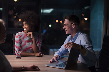 Image showing Multiethnic startup business team in night office