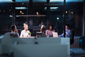 Image showing Multiethnic startup business team in night office