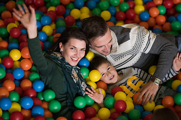 Image showing young parents with kids in a children\'s playroom