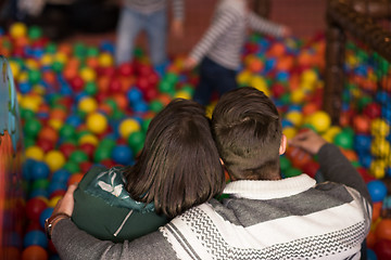 Image showing young parents with kids in a children\'s playroom