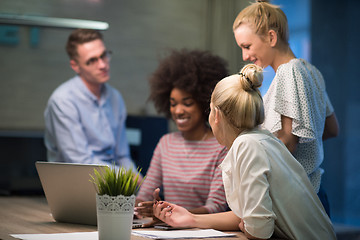 Image showing Multiethnic startup business team in night office