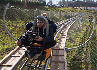 Image showing videographer at work on alpine coaster